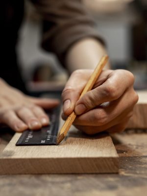 female-carpenter-working-studio-with-pencil